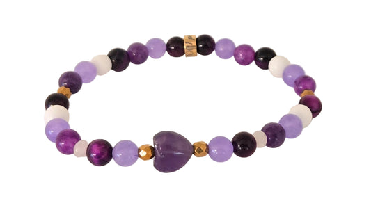 Bracelet Préma Quebec
Image principale : "Bracelet en pierres naturelles améthyste violette, œil de tigre, agate et jade"
Vue portée : "Bracelet multicolore en pierres naturelles porté au poignet"
Détail : "Perles de pierres naturelles améthyste, œil de tigre et jade sur bracelet élastique"